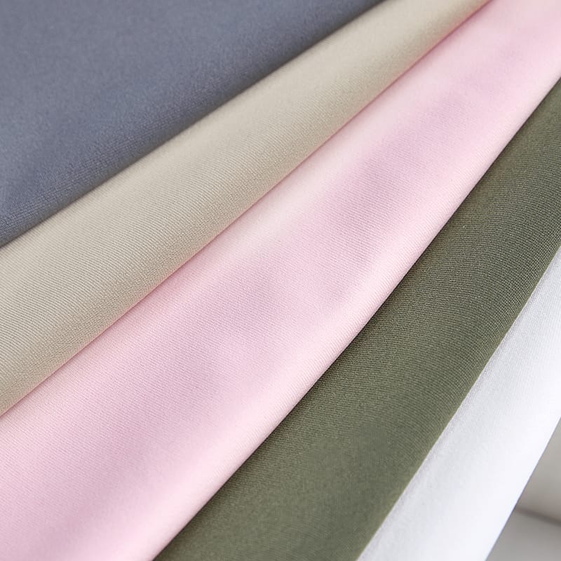 Fabric weight comparison showing different GSM categories from lightweight to heavyweight knitted fabrics